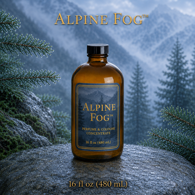 Alpine Fog™ perfume and cologne concentrate in an amber glass bottle with a blue-and-gold label, displayed against misty alpine mountains and wet silver fir branches - 16oz (480ml)