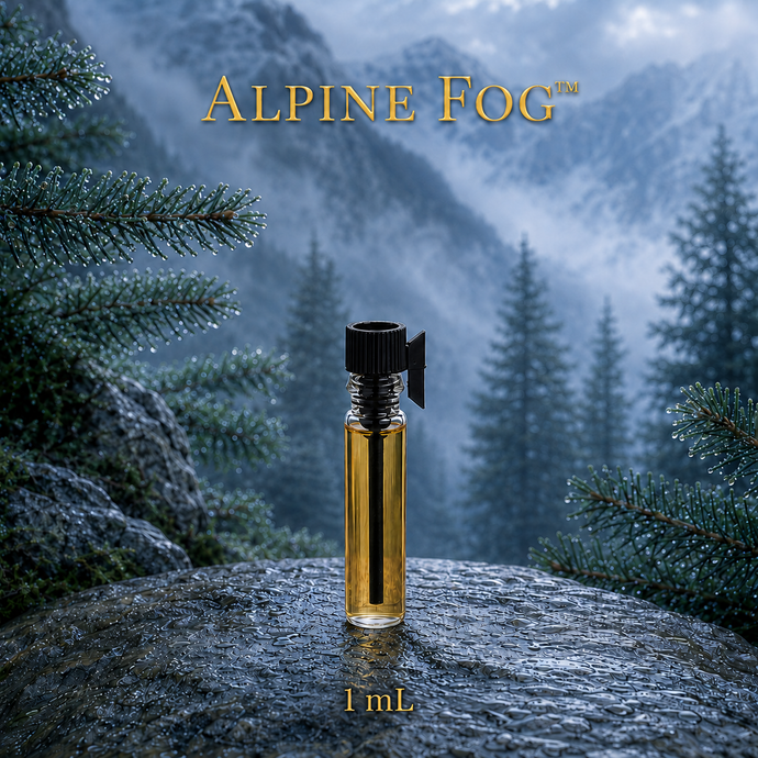 Alpine Fog™ perfume and cologne concentrate in an amber glass bottle with a blue-and-gold label, displayed against misty alpine mountains and wet silver fir branches - 1ml sample