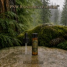 PNW Rainforest Fougère perfume concentrate sample vial with yellow liquid on a pale rock in a wet Pacific Northwest evergreen forest - 3.7ml Dram with pippet dropper